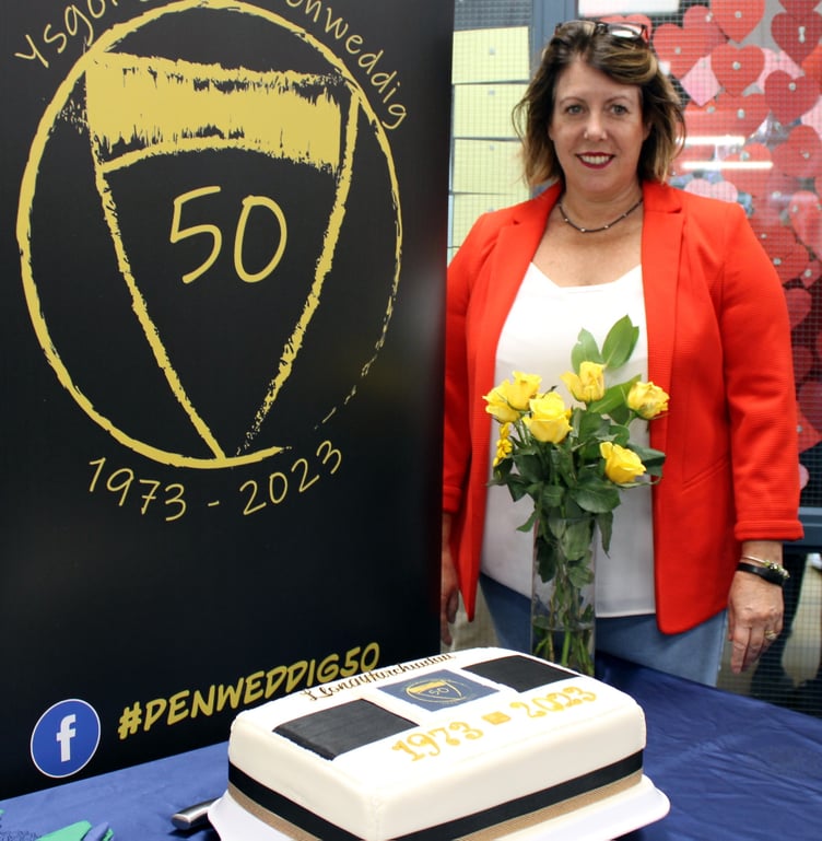 Sian Davies, a former student and current member of the administration team who created the celebratory cake