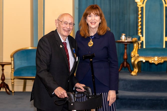 Dr Cyril Payne receives his Order of Australia Medal from the State Governor of Victoria, Margaret Elaine Gardner, at Government House in Melbourne on September 25