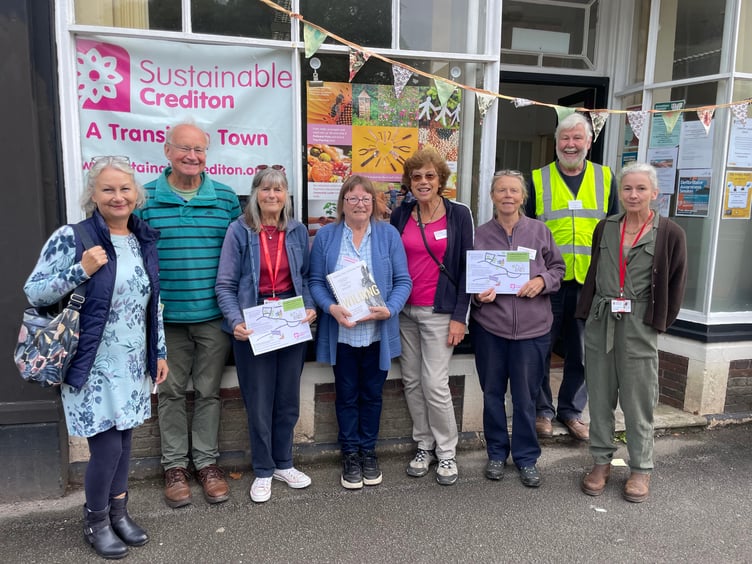 Dee Ross, fourth left, with her gift on her retirement as chair of Sustainable Crediton. AQ 7778