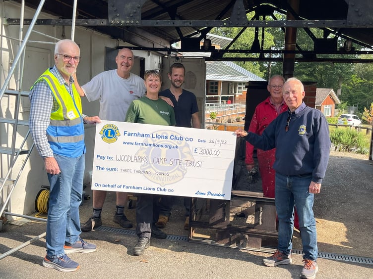 Farnham Lions hand over a cheque to Woodlarks Camp Site in south Farnham