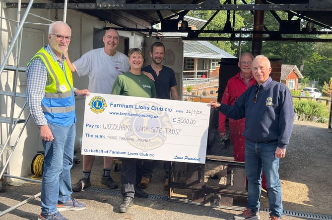 Farnham Lions hand over a cheque to Woodlarks Camp Site in south Farnham