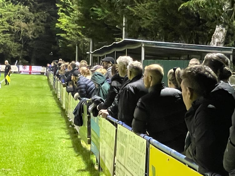 Crowds watching the match. AQ 8177