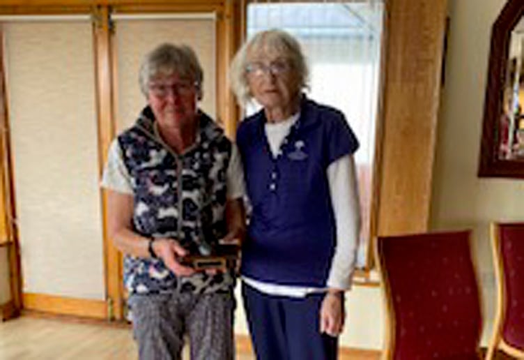 Captain Lynds Evans presenting the Evelyn Jenkins prize to Jean Harrison