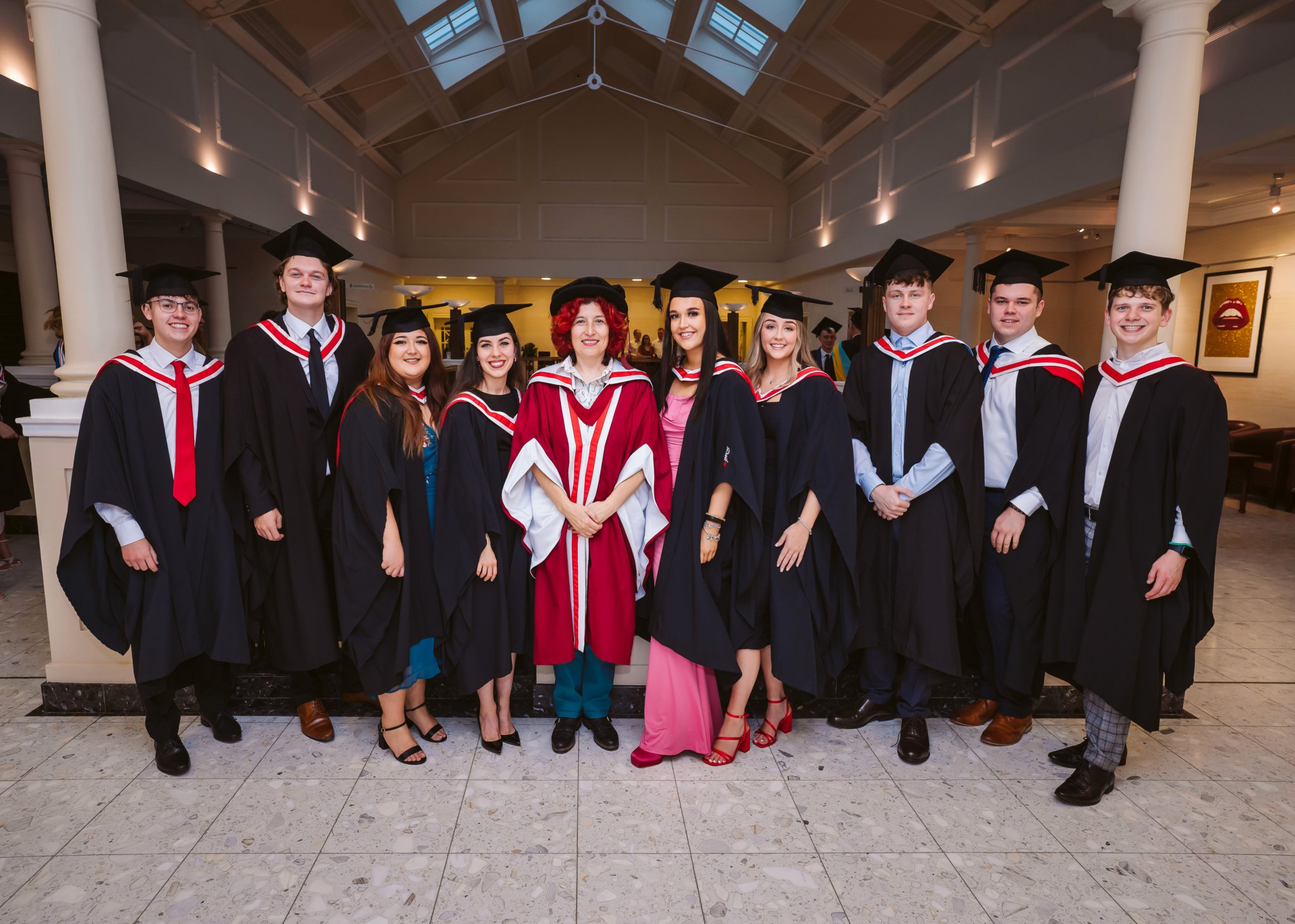Dr Florida Clements, Programme Leader for Business & Management, with her graduating class