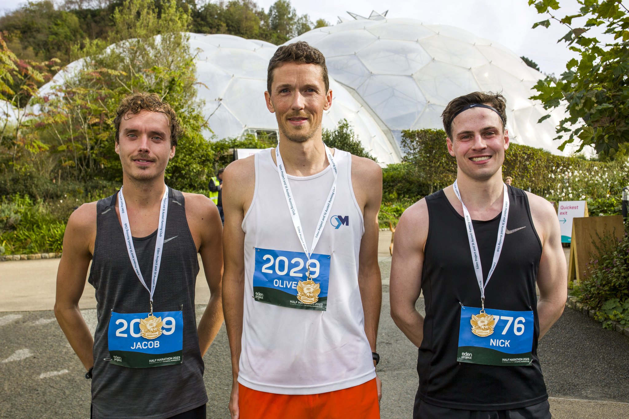 Eden Half Marathon winner Oliver Blake (centre), with second-placed Jacob Maddison (left) and third-placed Nick Pendrigh; below, the women’s top three of Laura Marco (centre) Ellie Robinson (left) and Niamh Smith (right)