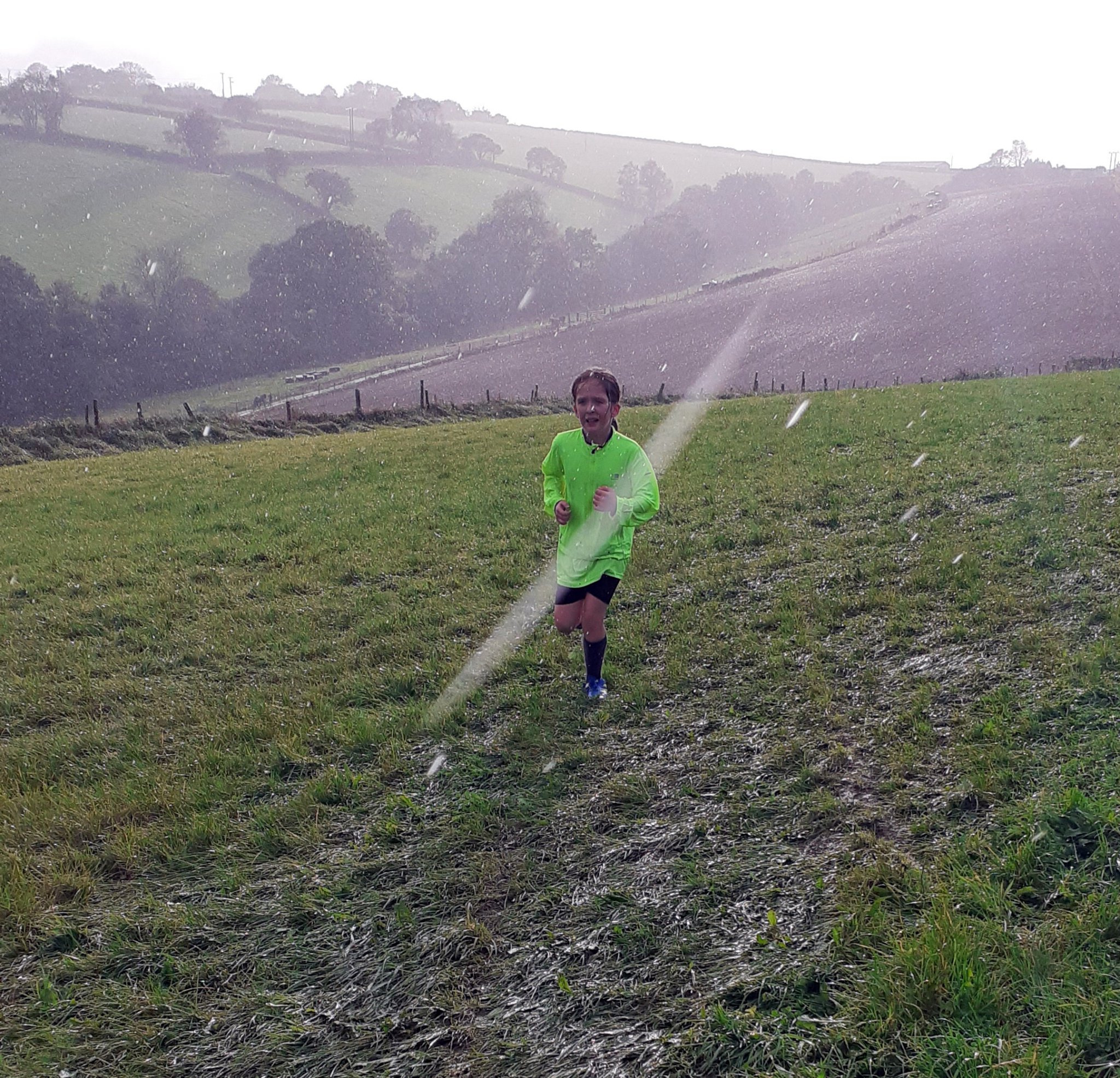 Ed and Irena Berrett: “Catherine during her first ever cross country race — she did amazingly well considering the weather and her asthma. She gave it her all, didn’t give up and finished the race. We couldn’t be more proud of her.”