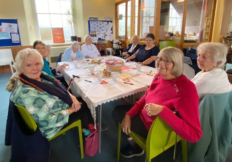 A group of people enjoying the Coffee Morning at Crediton Congregational Church. NP 121023 02