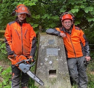 <p>Zoe Cotton and Jim Avenell clearing trees on Selborne Common</p>