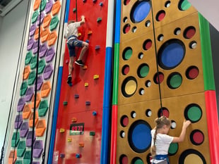 Ukrainian children go up the climbing wall at Alton Sports Centre