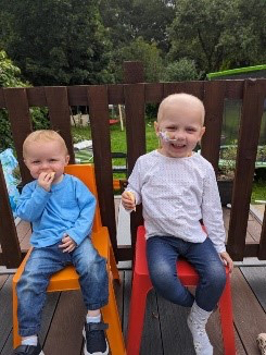 Esme with brother Isaac in their safe play area