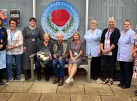 <p>Gill and Bob Elmer (sitting) were given flowers and an engraved vase by the Rosemary Foundation last week after raising more than £30k for the charity since 2014.</p>