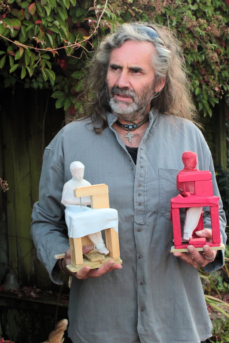 Rob Heard shows the size of the figures.