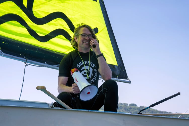 Marcus Kern, a regional representative for Surfers Against Sewage, at a paddle-out protest against sewage