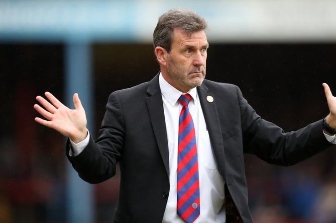 Aldershot Town manager Tommy Widdrington praised his side's character