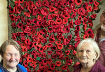 Children and villagers unite to remember with poppy creations