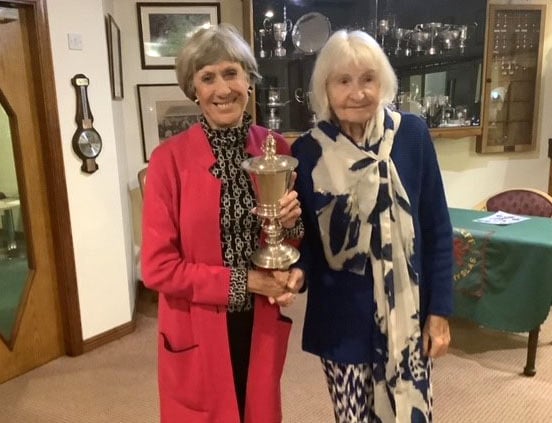 Karen Evans being presented the Clarke Cup by captain Lynda Evans