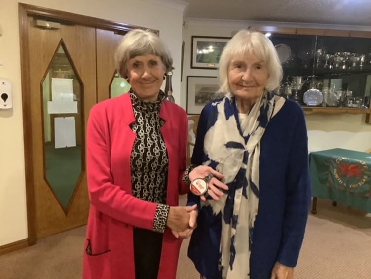 Karen Evans being presented the WG Medal by captain Lynda Evans