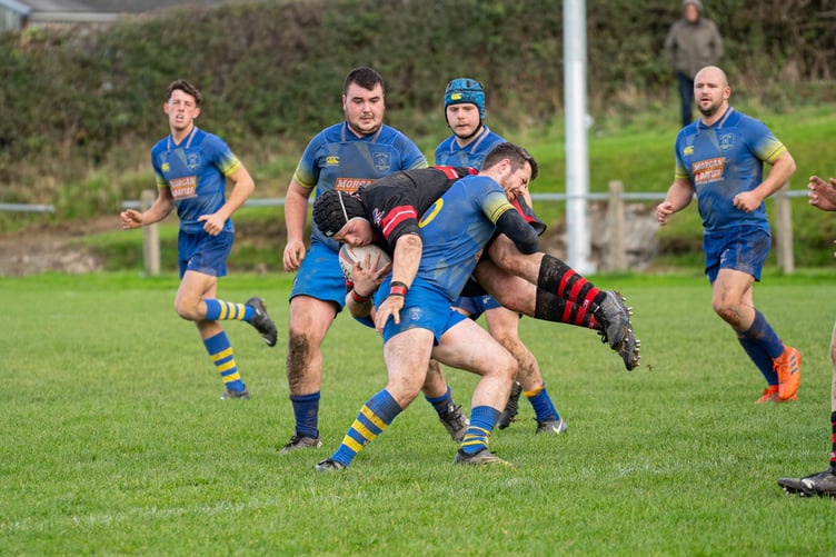 Sion Evans puts in a solid tackle