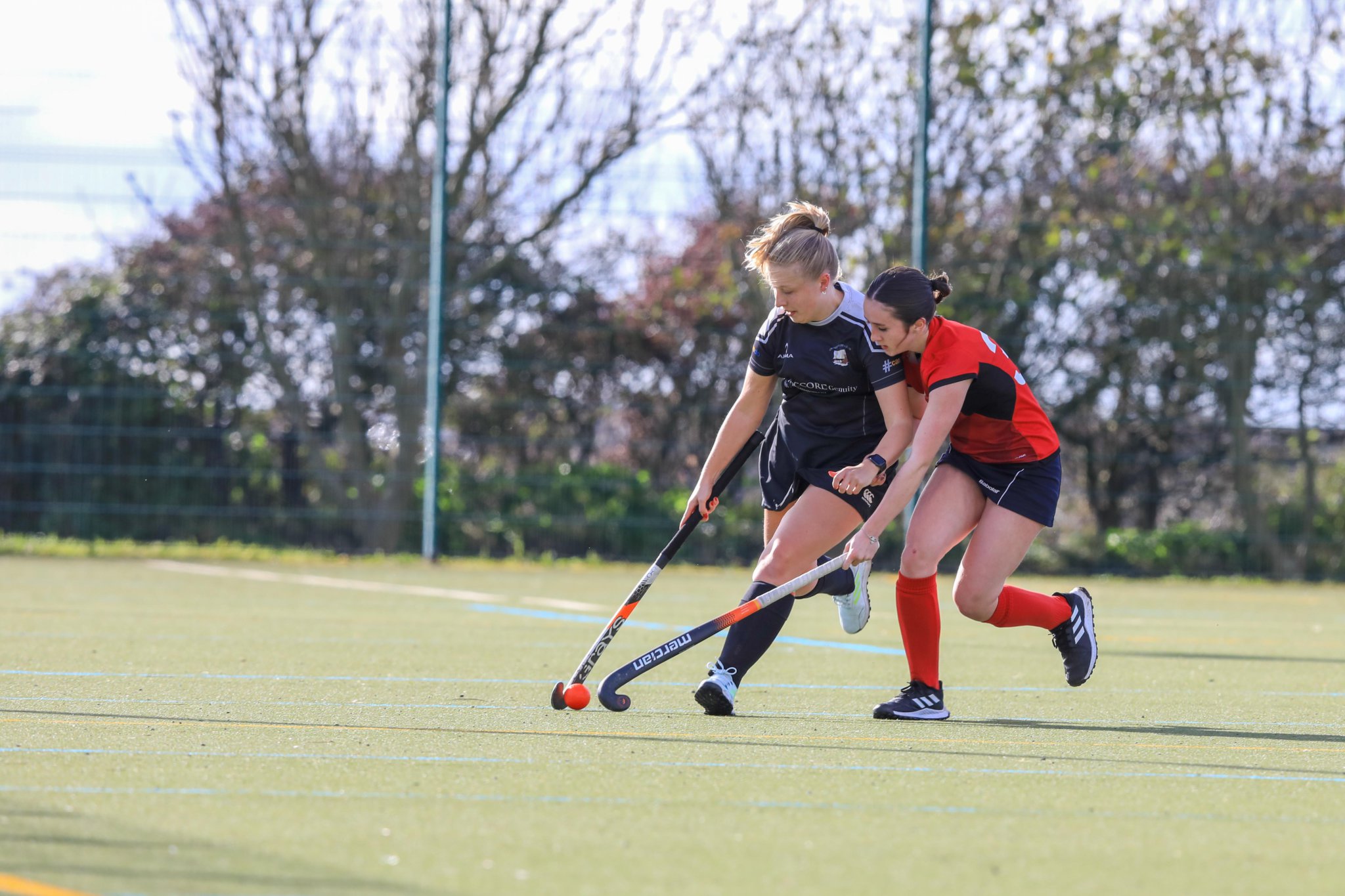 Canaccord Genuity Vikings C’s Nicola Watson (left) running the line under close attention from J. Qualtrough & Co Castletown Southerners’ Ruby McCubbin in last Saturday’s Division One clash at CRHS (Callum Staley/CS231021(17))