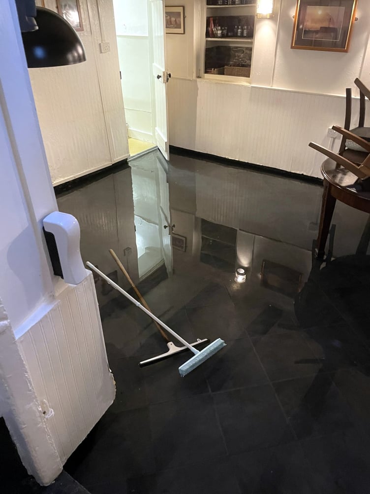 Flooding inside of a building in Looe. Picture: Matt Bear Clark
