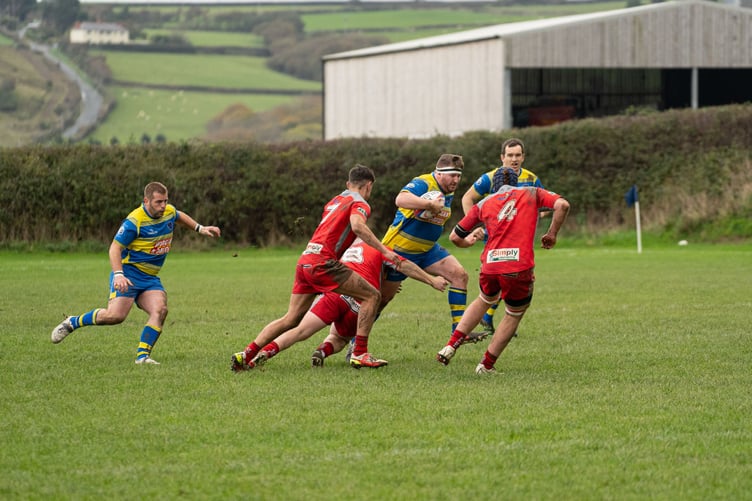 No.8 Ryan Williams rides a tackle