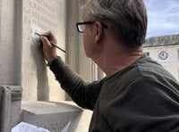 <p>It took an hour for specialist carver Robert Jolly to make the change on the memorial </p>