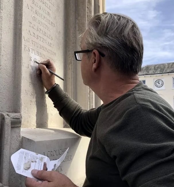 <p>It took an hour for specialist carver Robert Jolly to make the change on the memorial </p>
