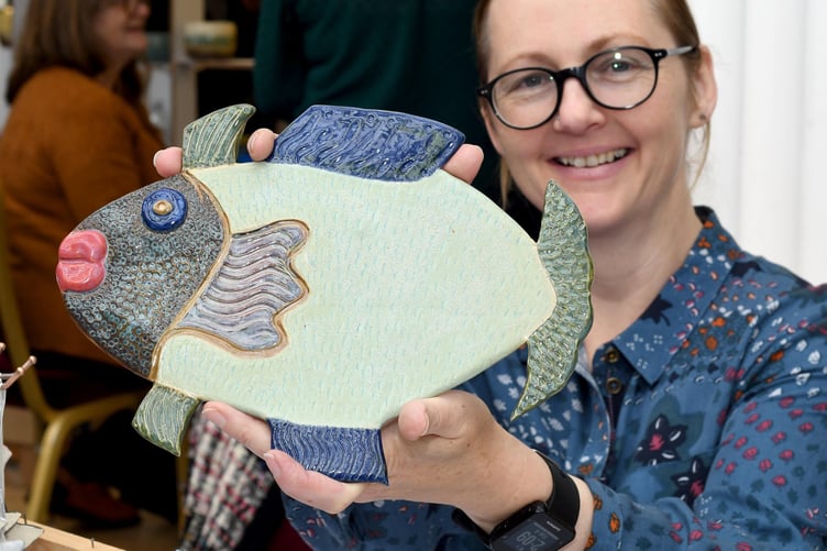 Manx Potters Fair at the Villa Marina Arcade - Linda Quirk with a ceramic dish