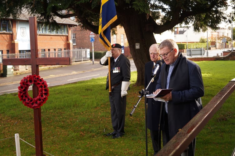 Wellington Royal British legion chaplain the Rev Sam Griffith leads a service of dedication of the Field of Remembrance with president Michael Rose and standard bearer Bob Trickey.
