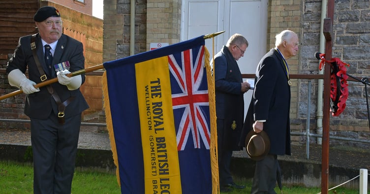 Wellington Royal British Legion standard bearer Bob Trickey lowers the standard during the dedication of the Field of Remembrance.