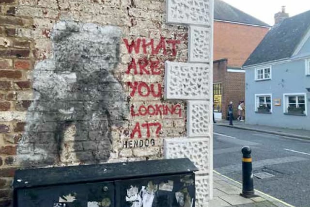 Street artist Hendog creates teddy bear on wall in Petersfield