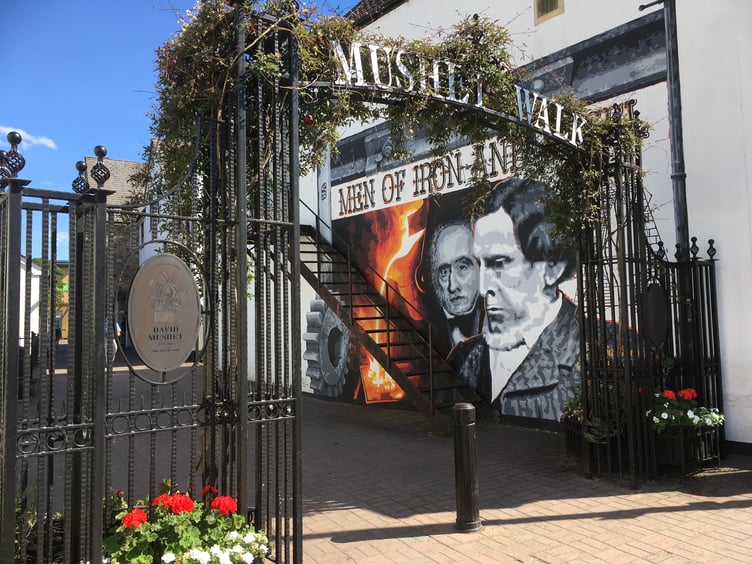 The Mushet Walk mural and archway in Coleford town centre