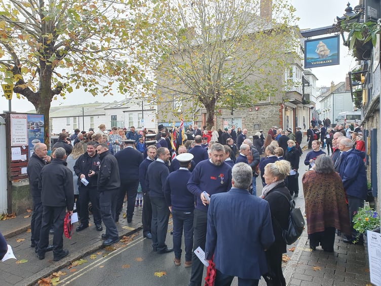 The public gather to pay their respects in Salcombe