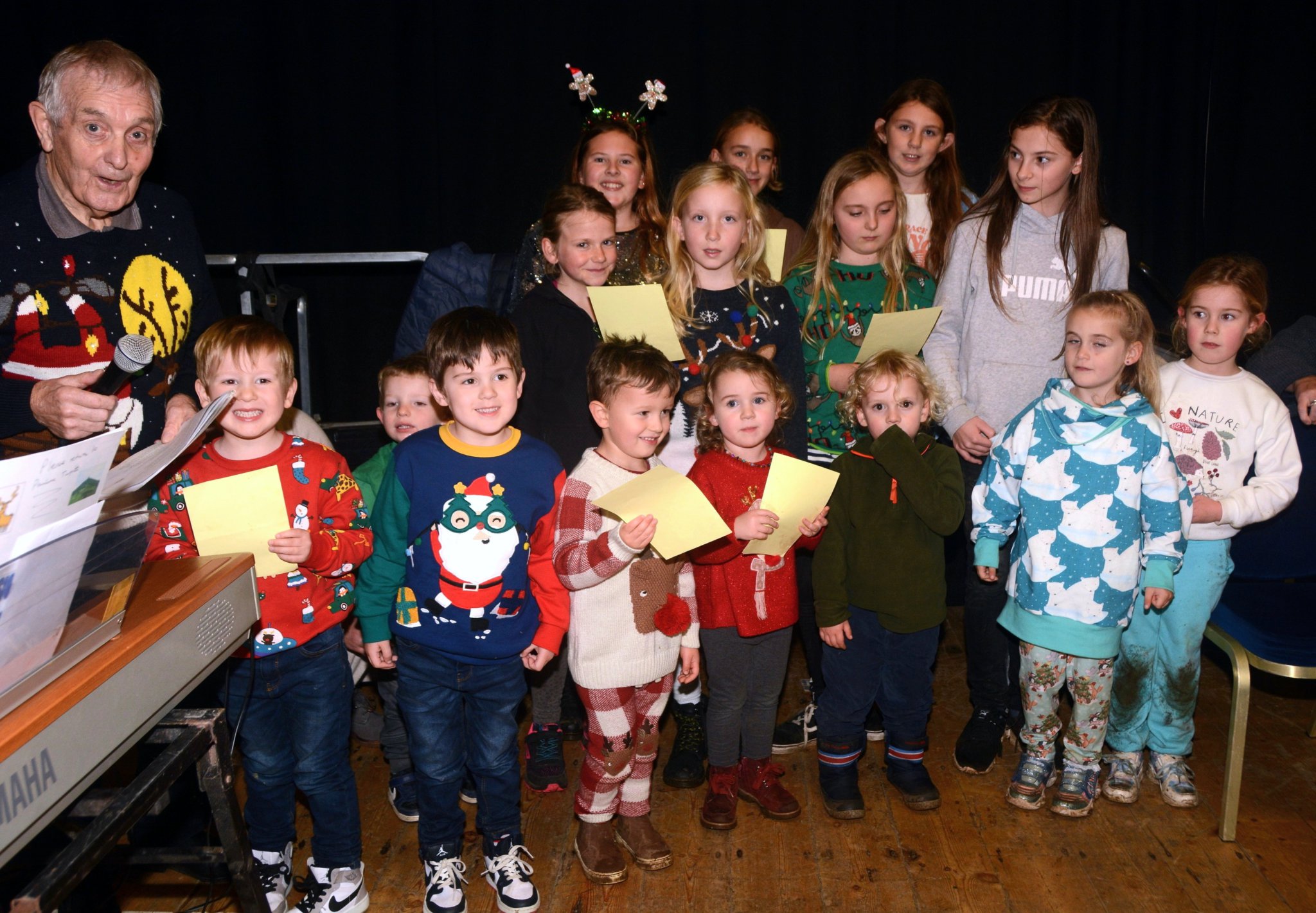 Mr Stephen Michael pictured with the children’s ‘choir’