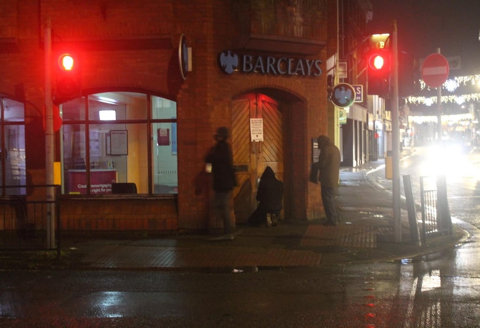 <p>An image supplied by Extinction Rebellion showing protesters gluing shut the doors of Farnham’s Barclays branch in The Borough</p>