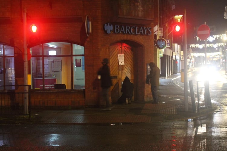 An image supplied by Extinction Rebellion showing protesters gluing shut the doors of Farnham’s Barclays branch in The Borough