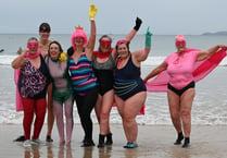 Superheroes take a cold dip to raise money for charity