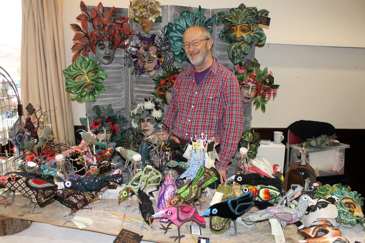 Teresa Rodrigues’ stall was busy with sales of handmade masks, here sold by husband Graham. The couple come from Sandford. AQ 0038