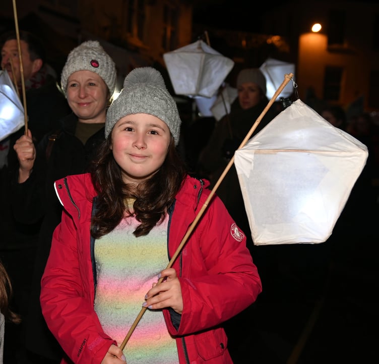 Laura in the parade with her lantern