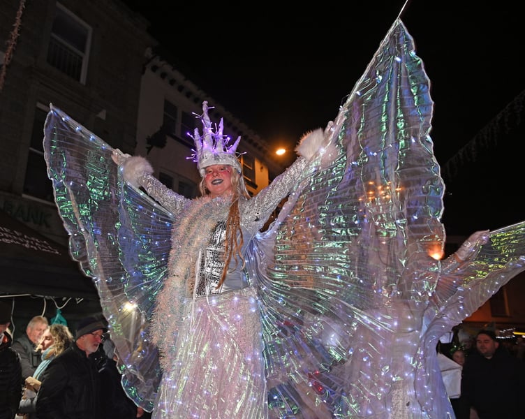 A spectacle of magic heads through the town