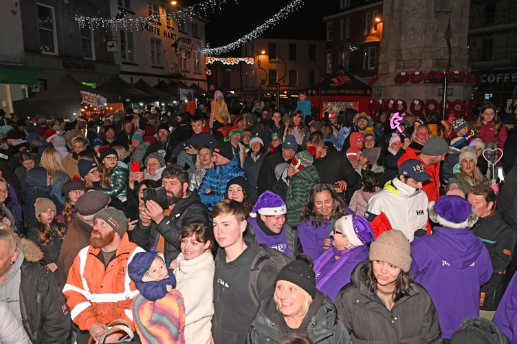 A packed town square as people get in the Christmas spirit