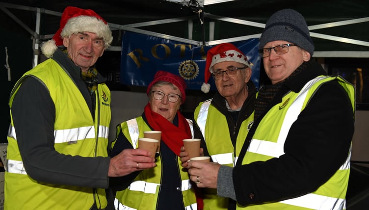 A warm welcome awaits serving the delcioius mulled wine are Launceston Rotary Club members Kim, Sandra, Alan and Kevin