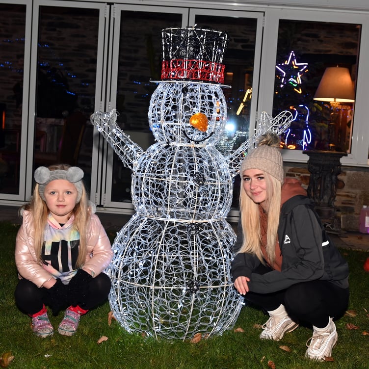 Storm and Lani with a Snowman