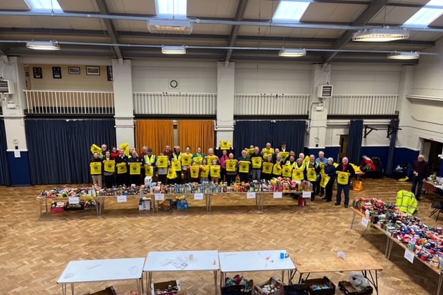 Farnham Lions' members with their haul of Christmas parcels at the Army Reserve Centre in Guildford Road