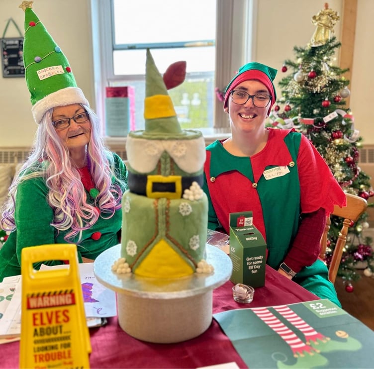 Delia and Emma with he ‘guess the weight of the Elf cake’