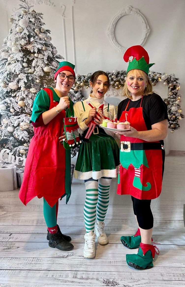 Cafe staff Teresa and Raven with volunteer Emma