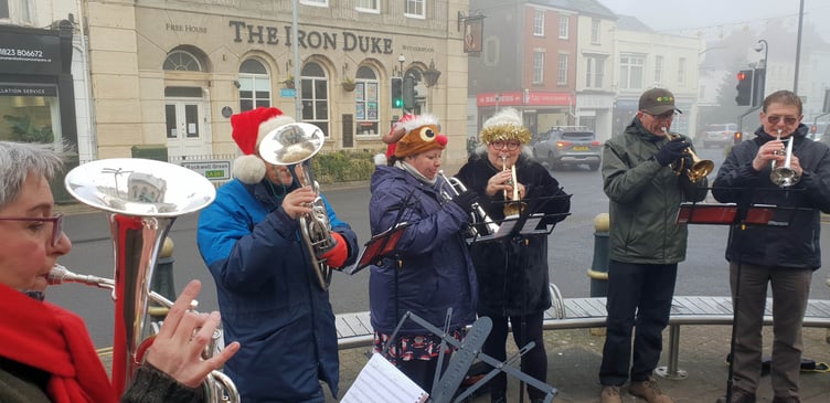 The damp weather has not put off Wellington Silver Band members from entertaining shoppers in the town centre.