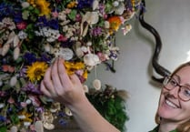 National Trust installs Christmas garland comprising 25,000 flowers