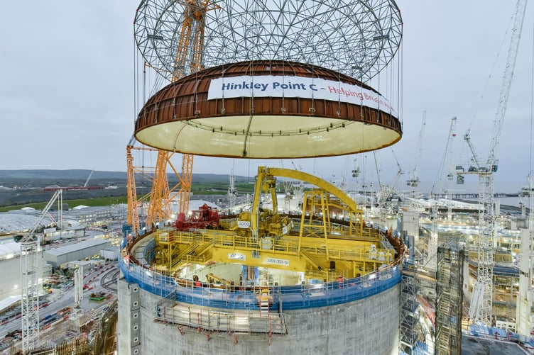 Big Carl, the world's largest crane, was used to lift Hinkley C's first reactor building dome into place.
