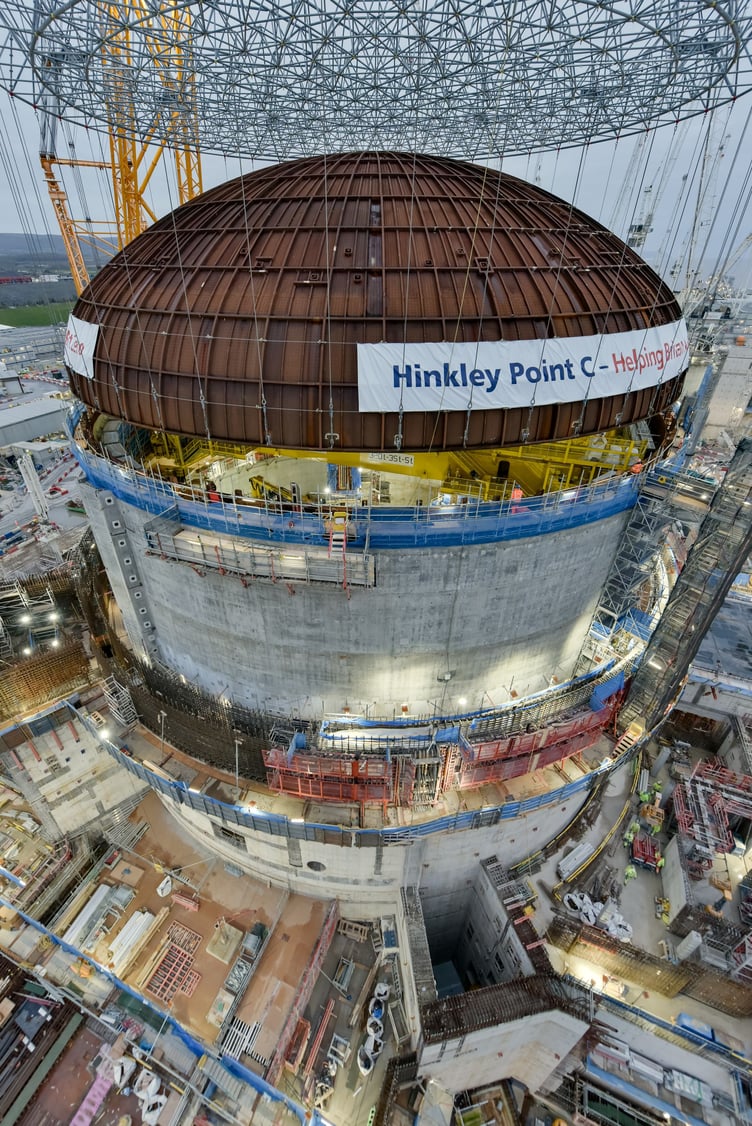 Hinkley C's first reactor building dome is carefully put into place.